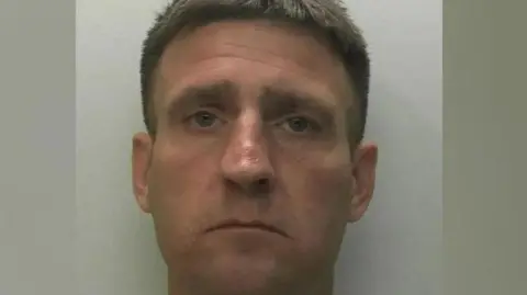 Devon & Cornwall Police Guy Sullivan, custody headshot taken by police