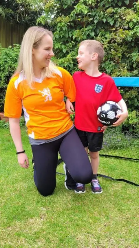 Emily Knight/PA Wire Emily Knight in a Holland football top looking at Edwyn, 6