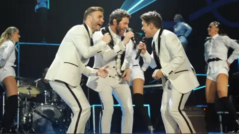 Take That on stage in 2014