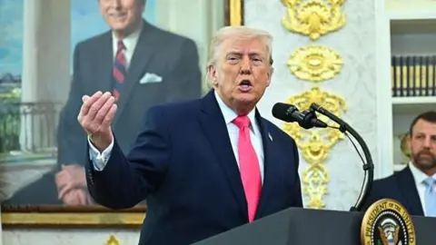 Dpnald Trump speaking to reporters