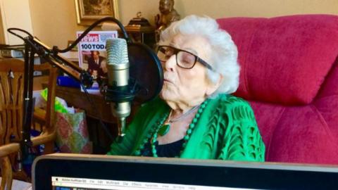 100-year-old Katri Hay recording her podcast