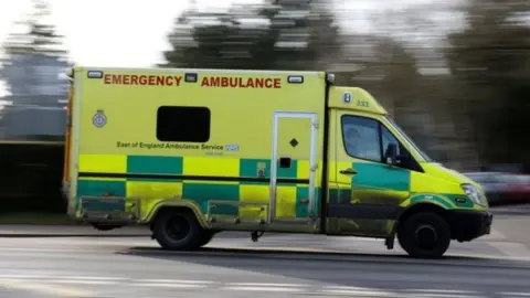 A stock photo of an ambulance being driven