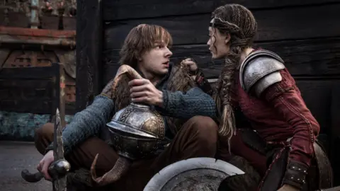 Universal Pictures Mason Thames as Hiccup Horrendous Haddock III and Nico Parker - Astrid