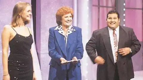 ITV Jenni Falconer, presenter Cilla Black and Donda Michaelas standing on the Blind Date studio set in 1994