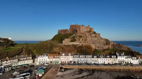 An aerial view of Gorey castle, the pier which hosts much of the fete is visible in the foreground. 