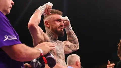 Lewis Crocker celebrates his victory