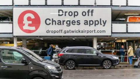 Cars in the drop off parking outside Gatwick's North Terminal