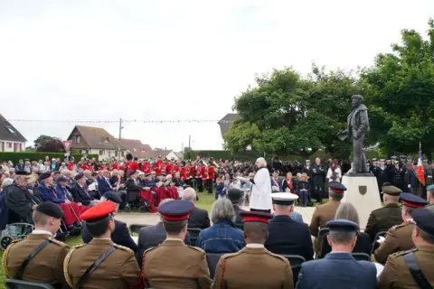 Gareth Fuller/PA Media D-Day veterans at the statue of Field Marshal Montgomery