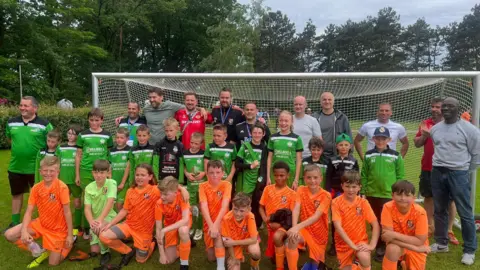 St Johns FC/Neil Frost The St Johns team with their Belgium competition