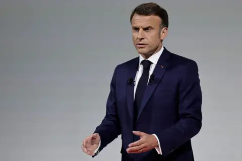 STEPHANE DE SAKUTIN / AFP France's President Emmanuel Macron delivers remarks during a press conference 