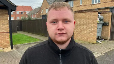 George Torr/BBC Image of Callum Caves. He is wearing a black jumper.