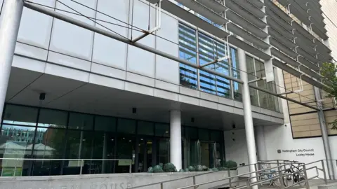 A building with pillars and lots of windows with the words nottingham city council on the front.