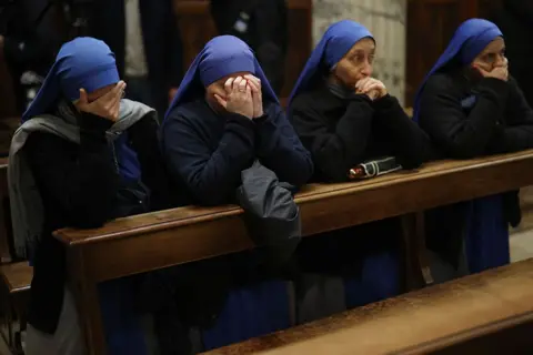 Reuters Nuns pray as Pope Francis continues his treatment at Gemelli Hospital, at Santa Maria Addolorata, in Rome, Italy, on 25 february 25, 2025