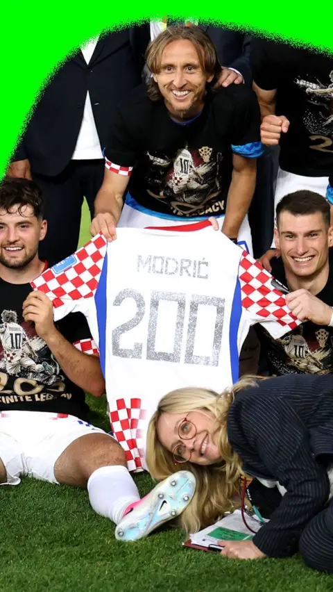 Luka Modric with a shirt commemorating making 200 international appearances