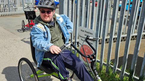 A man on an adapted bicycle