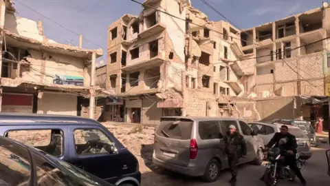 War-damaged buildings successful  the Eastern Ghouta, a suburb of Damascus (10 December 2024)