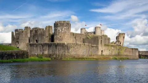 Getty Images The outside of Caerphilly Castle, which has a large moat running outside it
