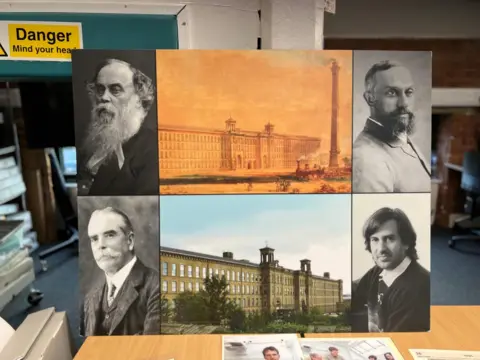 Saltaire World Heritage Education Association A montage picture board sitting on a table shows four men, through different time periods, and both old and new pictures of a mill building with a tall chimney.