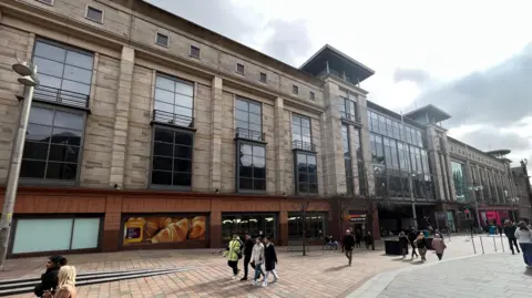 BBC A street view of the Buchanan Galleries with shoppers walking by