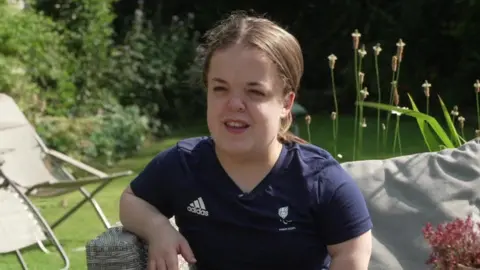 BBC Paralympic powerlifter Lottie McGuinness in her garden