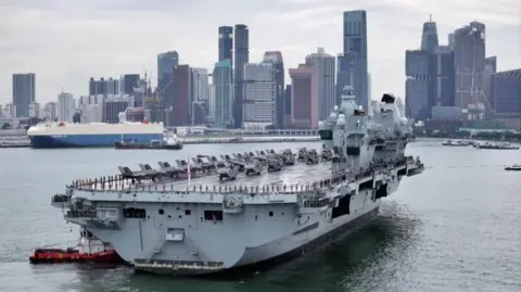 HMS Prince of Wales, one of the UK's largest warships, seen here arriving at the port of Singapore. 