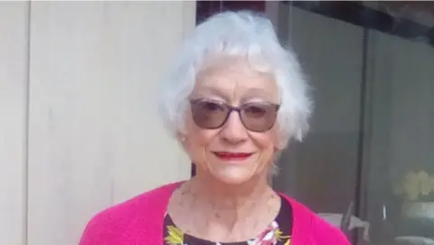 Leicester Royal Infirmary Gillian Stacey, wearing a pink cardigan, looking at the camera