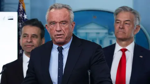 Getty Images Rorbert F Kennedy Jr and other health officials at a news briefing