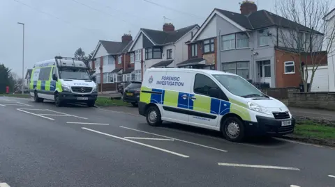 Police in Broad Avenue in Leicester