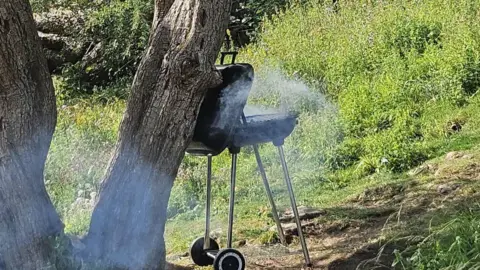 Derbyshire Fire and Rescue Service A BBQ next to a tree