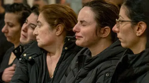 Kareen Elia, 24, the fiancee of Salim Isker, cries at a memorial service for him in Orebro on Thursday.