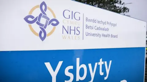 BBC Wales Sign for Betsi Cadwaladr health board outside hospital