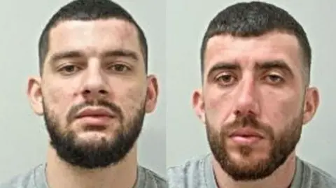 Lancashire Police Two mugshots side by side of two young men. They each have short beards and clipped hair and are wearing grey t-shirts. 