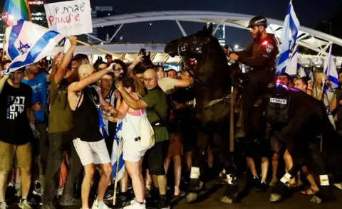 Reuters Mounted police in scuffle with crowd, Ayalon Highway in Tel Aviv, 25 Jul 23