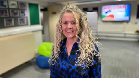 Alicia Wynn from Young Gloucestershire centre, smiling into the camera.