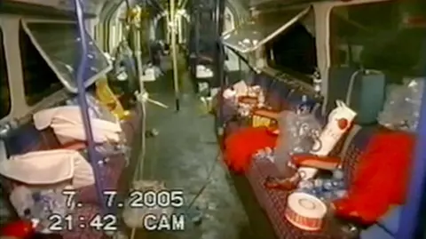 Coroner's Inquest via PA The inside of train showing debris scattered over the seats and windows hanging open.