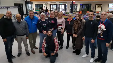 Amar Azam Members of the Luton Foodbank with staff from Chiltern Academy