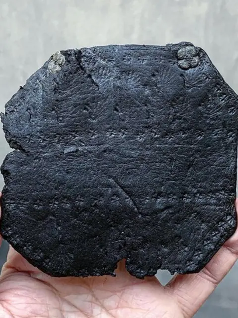 Alessio Checconi Made of thick leather, the wrist guard is decorated with punched scallop shell and small cross motifs