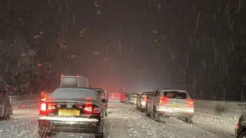 Anna Damski Cars in snow on M25 near M11 junction