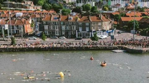 Tough Runner Participants in the triathlon swimming