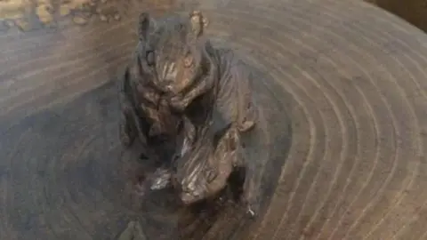 Sophie Edmondson Wooden mice carved into the urn