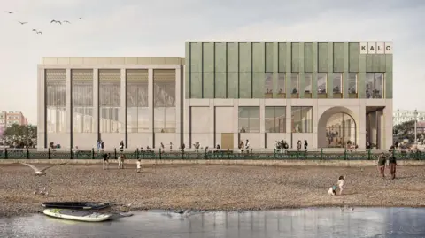 An artist's impression of a large rectangular building with windows on all sides and an arched doorway in the right corner. The letters on the top right of the building read 'KALC'. In front of the building is a beach with the sea in the foreground. There are people on the beach and two kayaks on the edge of the water.
