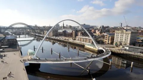 Gateshead's Millennium Bridge and Newcastle's Tyne Bridge