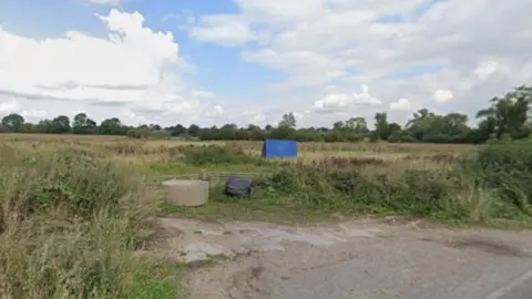 A field by a roadside