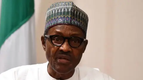 Getty Images Nigerian President Muhammadu Buhari speaks during a joint press conference in Abuja, on August 31, 2018.