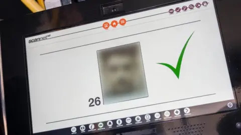 NPFCC Computer with a screen showing a pixilated face. 