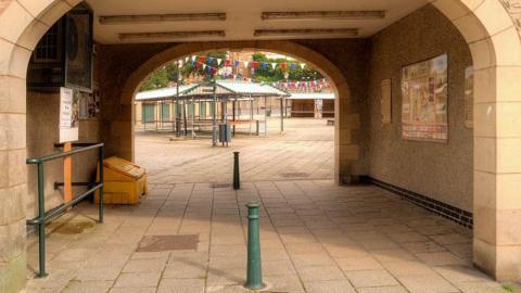 Entrance to Clitheroe Market, showing the archway and stalls beyond