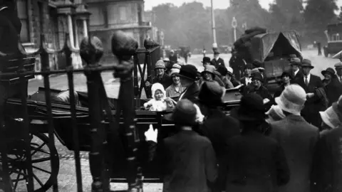 Getty Images June 1927: Princess Elizabeth entering the gates of 145 Piccadilly, the home of the Duke and Duchess of York, in London