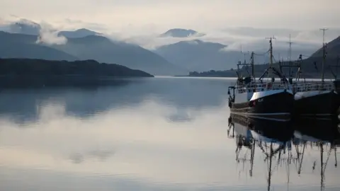 Getty Images Fishing boats at Ullapool