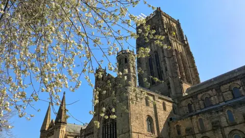 Chapter of Durham Cathedral Cathedral tower with blossom