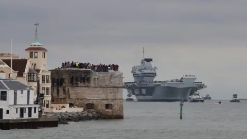 Royal Navy HMS Prince of Wales entering Portsmouth